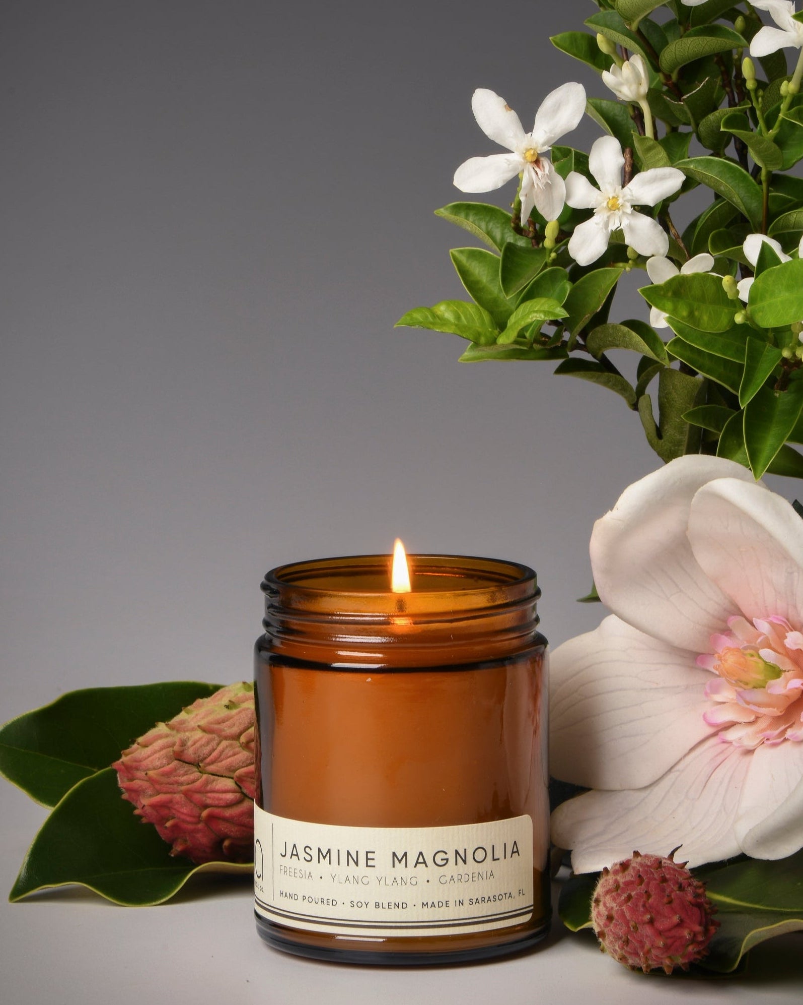 jasmine magnolia classic candle with scent notes, magnolia flower, jasmine and greenery