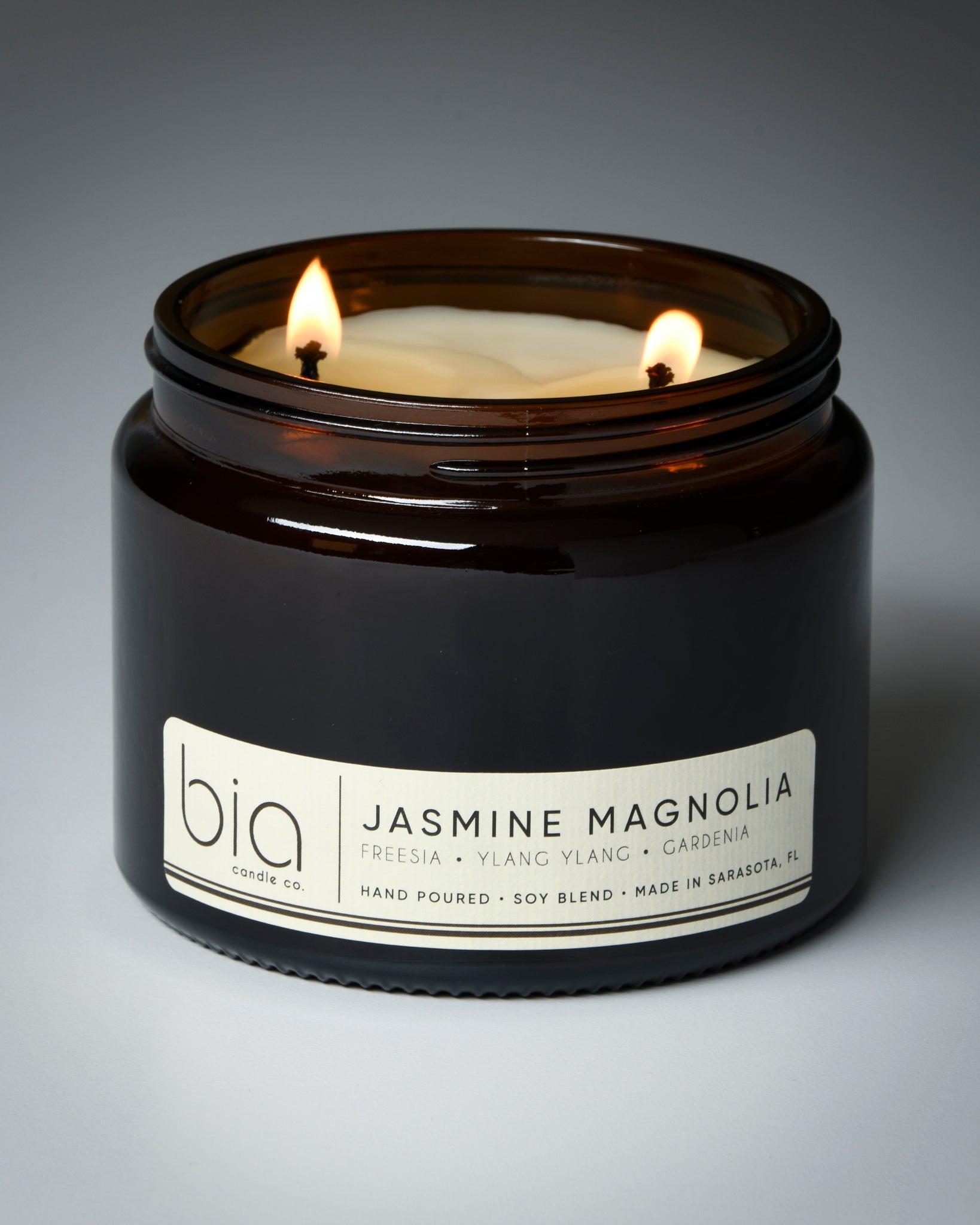 jasmine magnolia grande two-wick candle with gray background