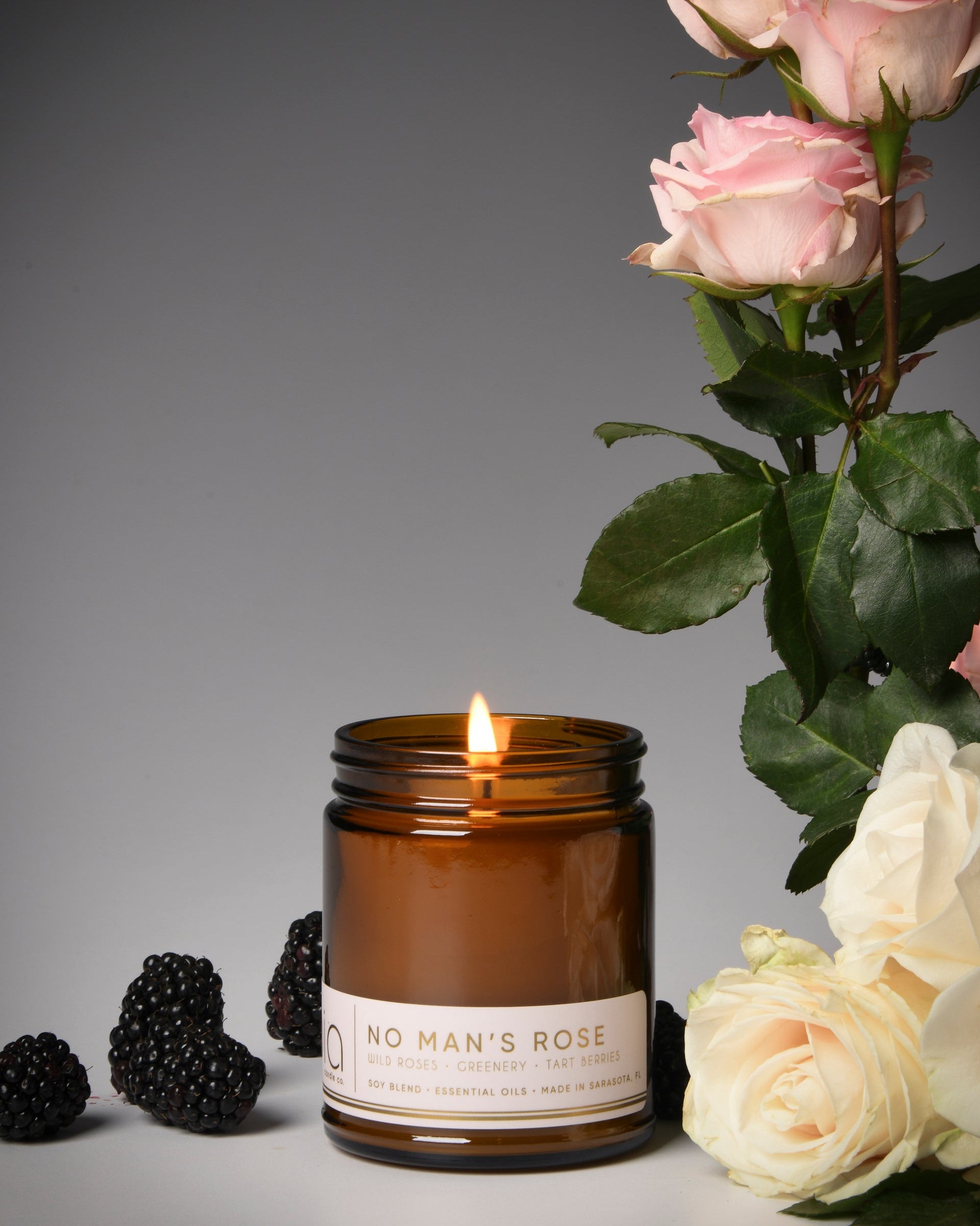 no man's rose classic candle, berries, rose
