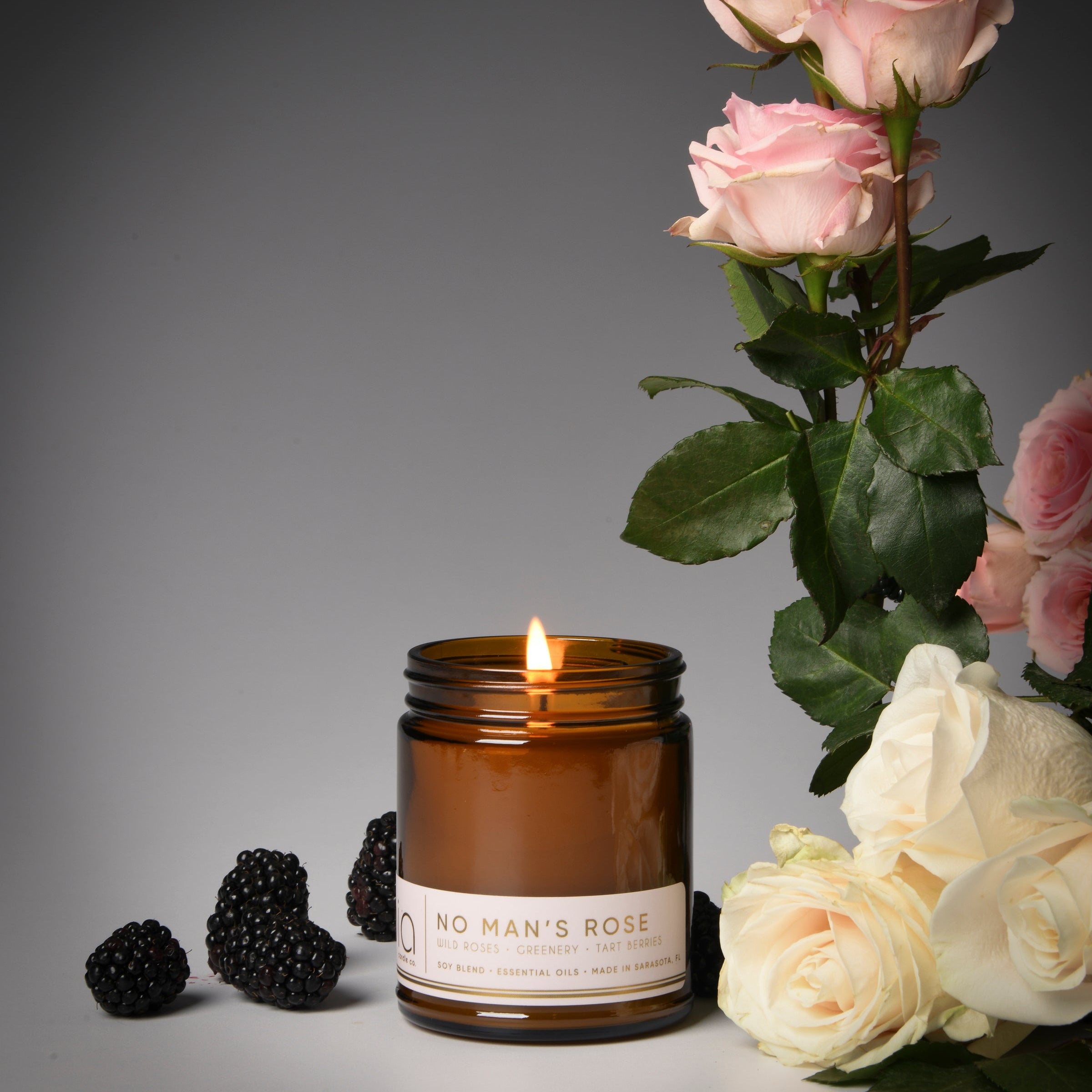 no man's rose classic candle, berries, rose