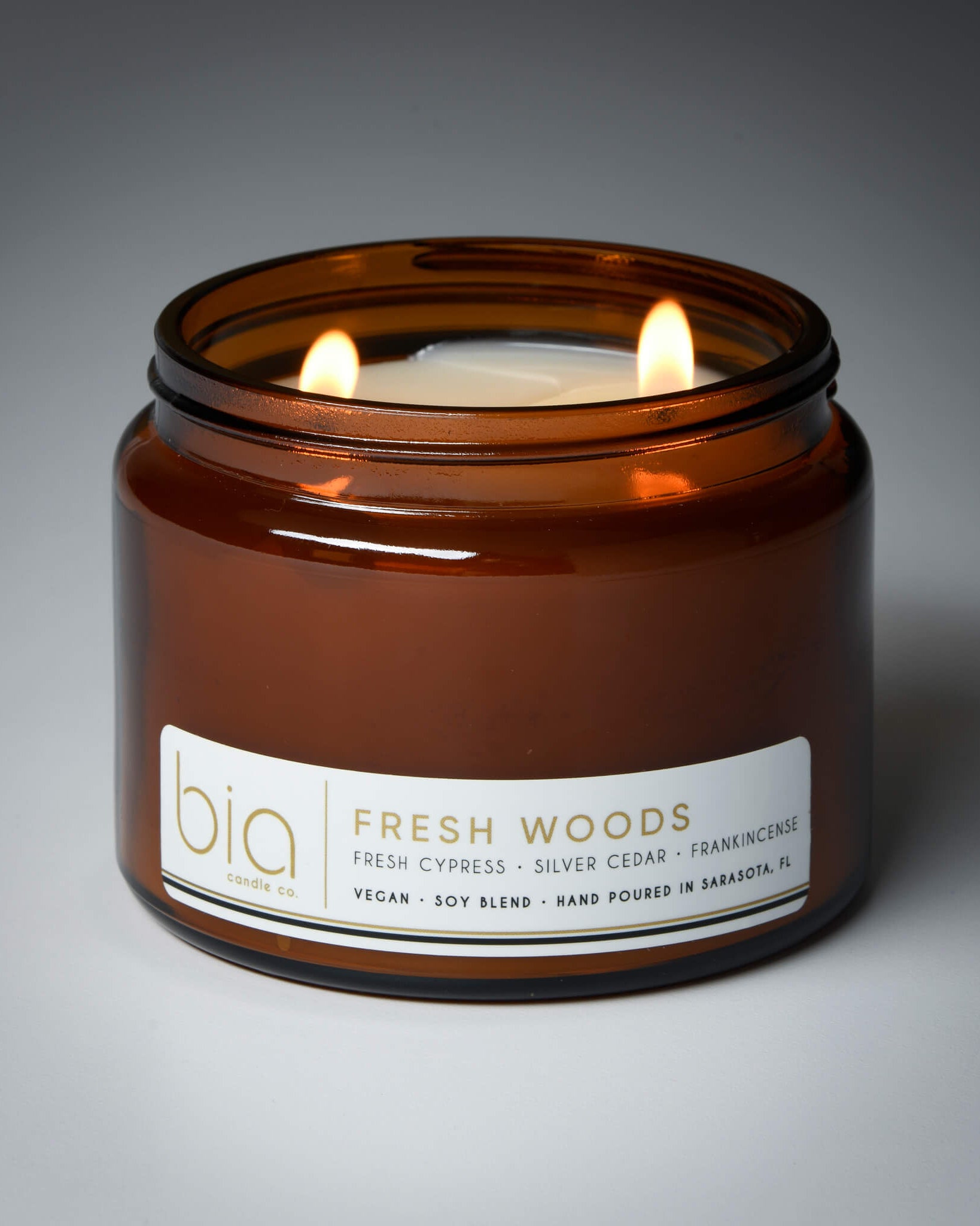 fresh woods grande two-wick candle lit 50 hour burn