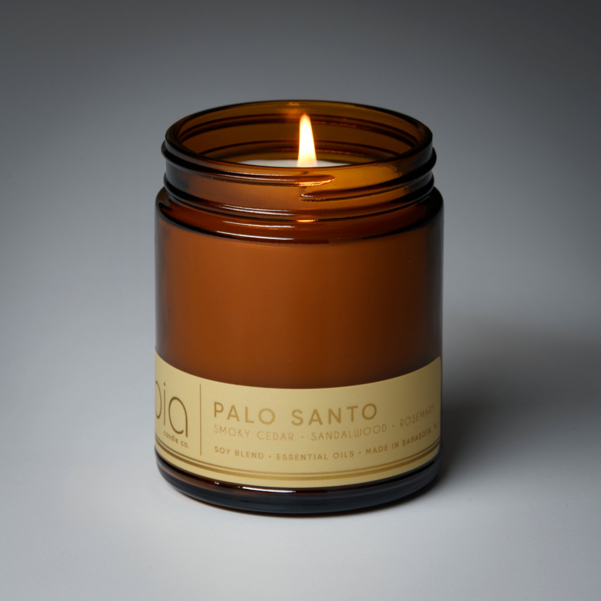 palo santo classic candle with wick lit