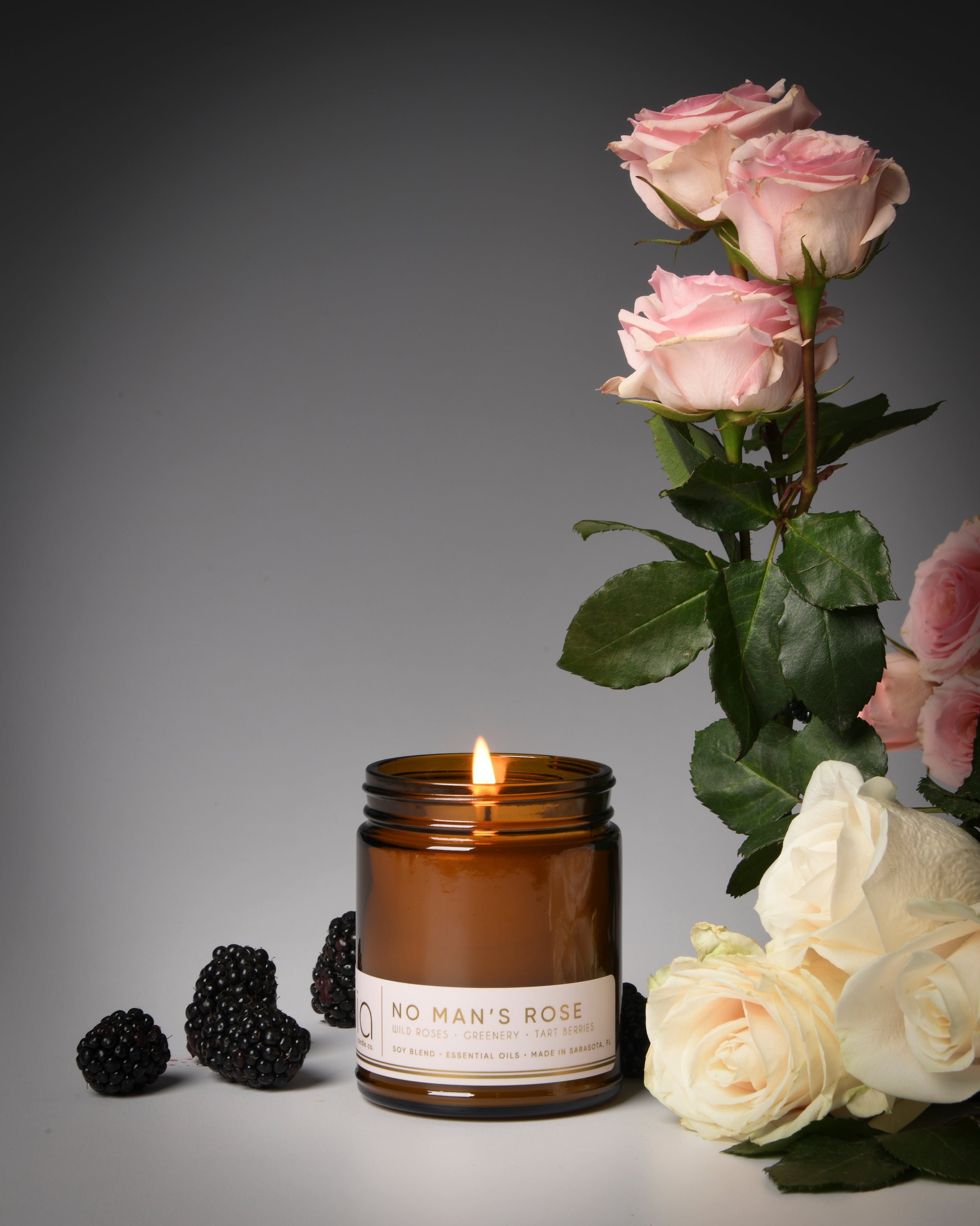 no man's rose classic candle, berries, rose