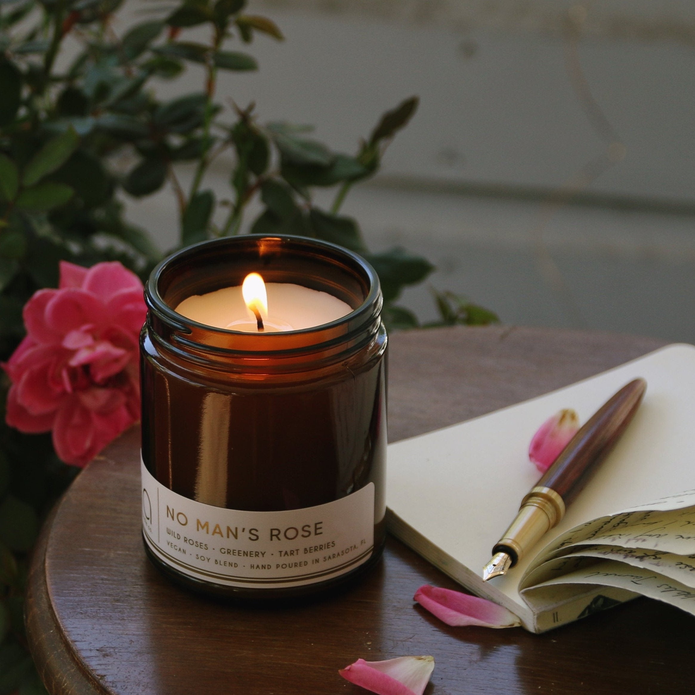 No Man's Rose with book and flowers