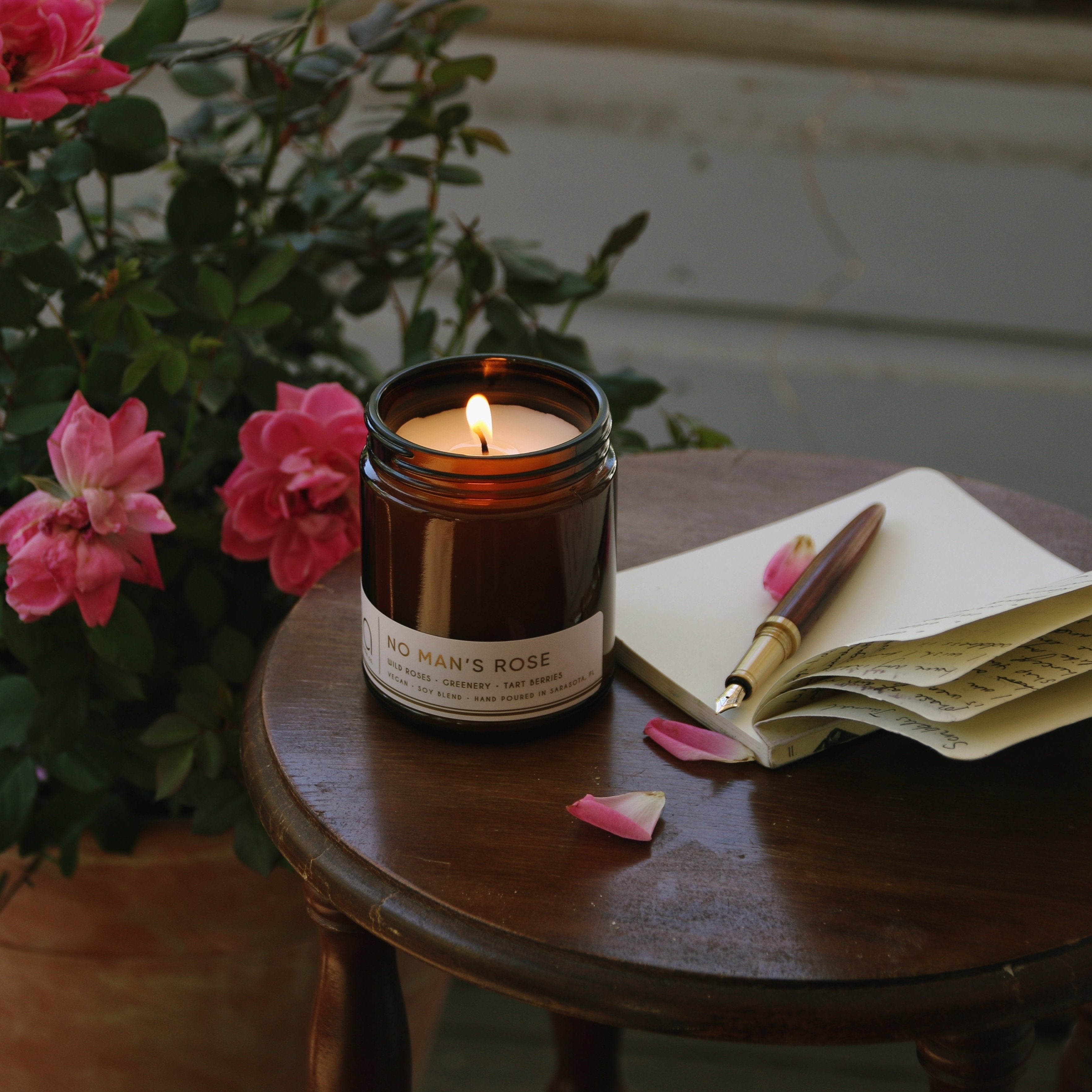 No Man's Rose with book and flowers