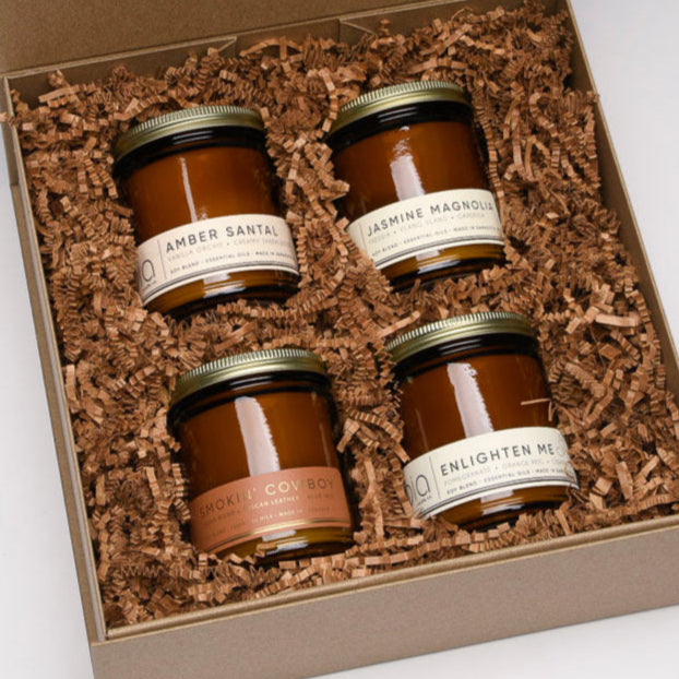 best sellers gift box, four candles with amber santal, jasmine magnolia, smokin cowboy, and enlighten me
