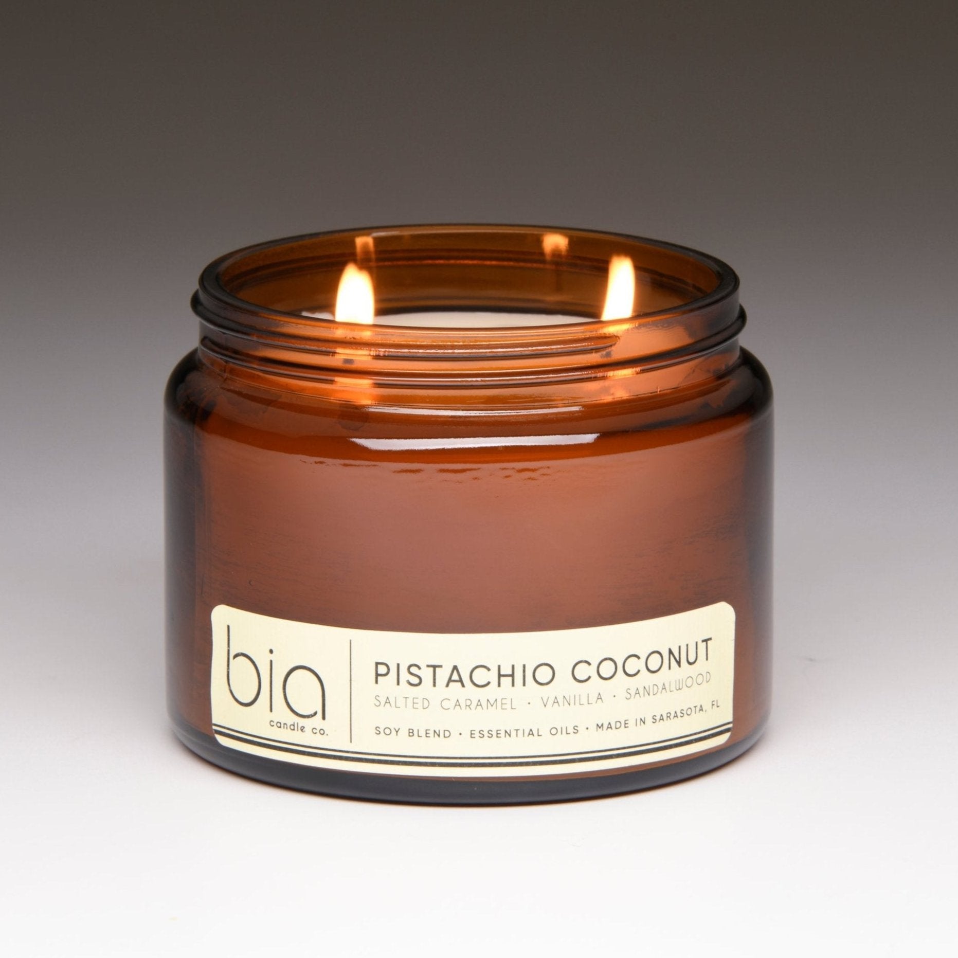 pistachio coconut grande two-wick candle lit