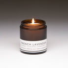 french lavender petite candle with gray background lit