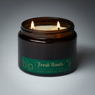 grande 2wick Candle in a brown jar labeled 'Fresh Woods' by bia on a gray background