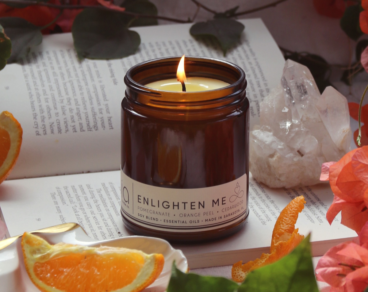 enlighten me classic candle with crystal, flowers and orange slice