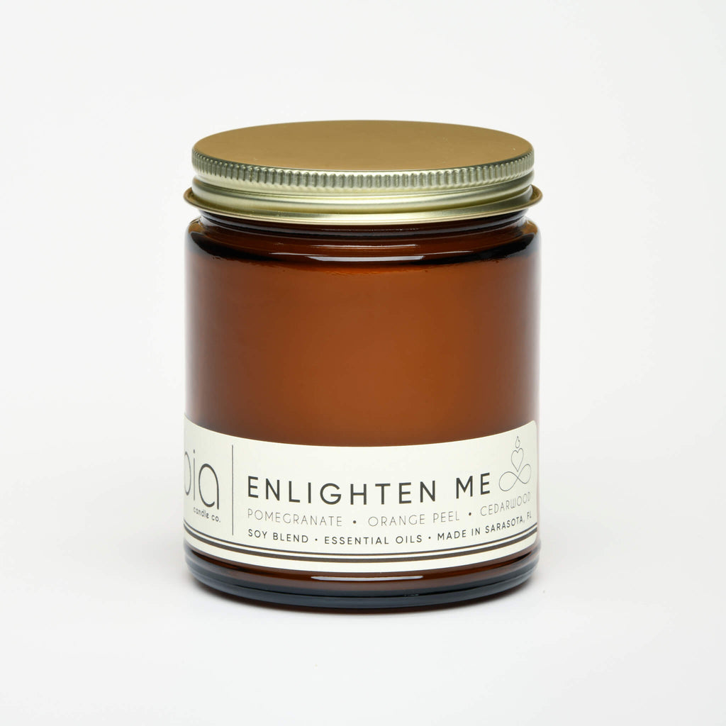 unlit and lidded single wick enlighten me soy candle on white background