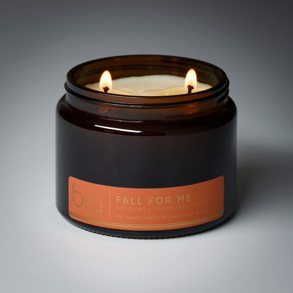 lit 2 wick fall for me soy candle on grey background