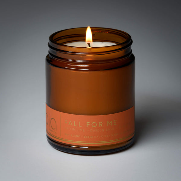 lit single wick fall for me soy candle on grey background