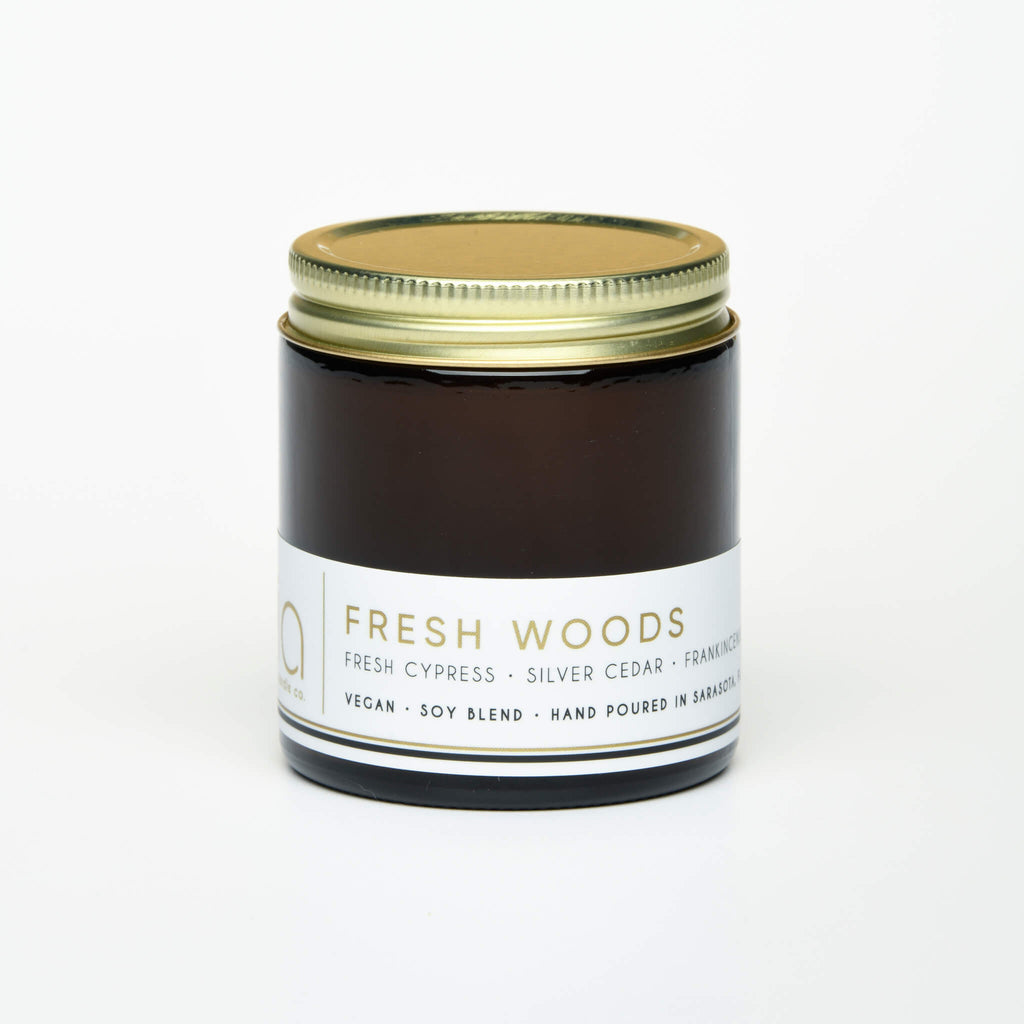 unlit and lidded petite single wick fresh woods soy candle on white background