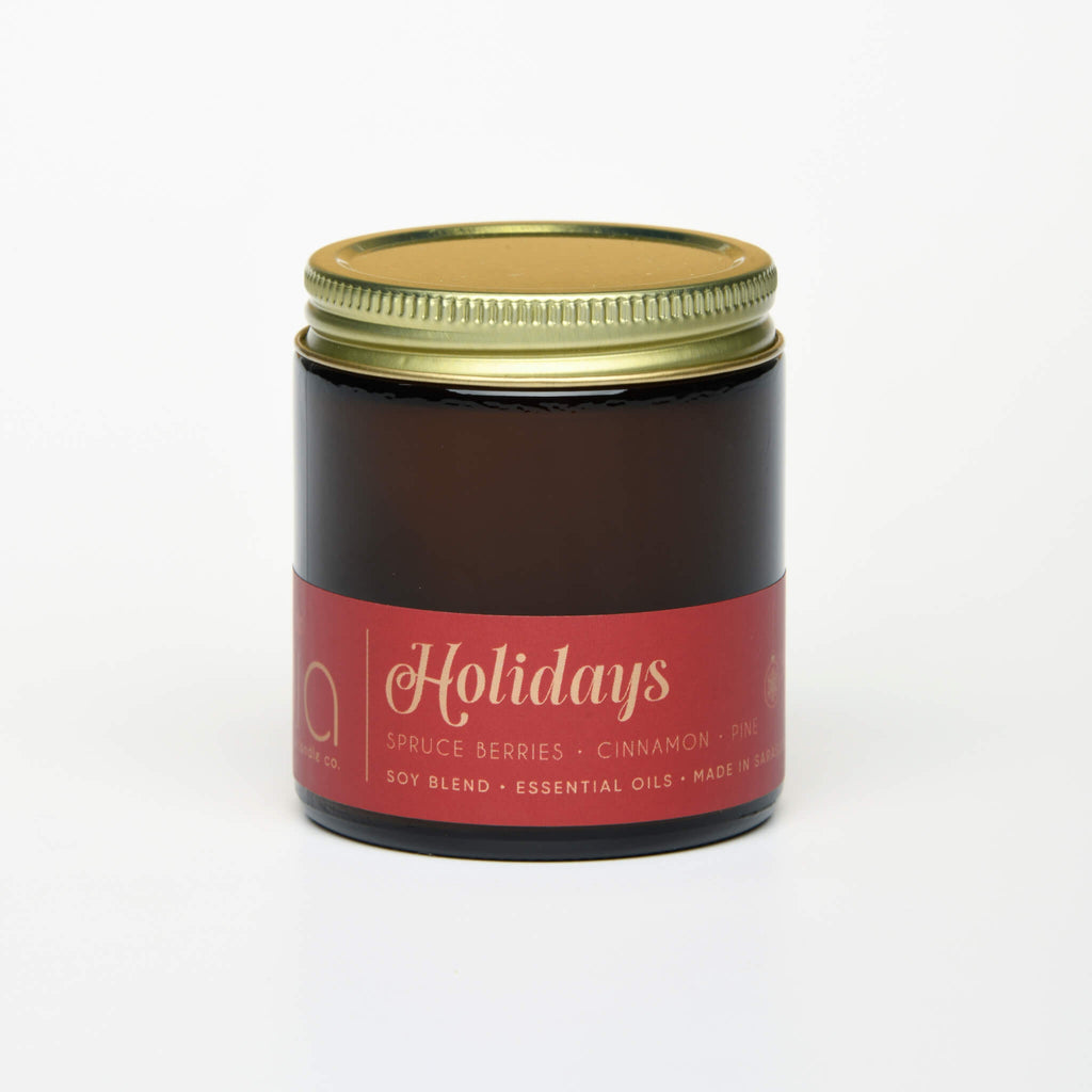 lit petite single wick holidays soy candle on white background