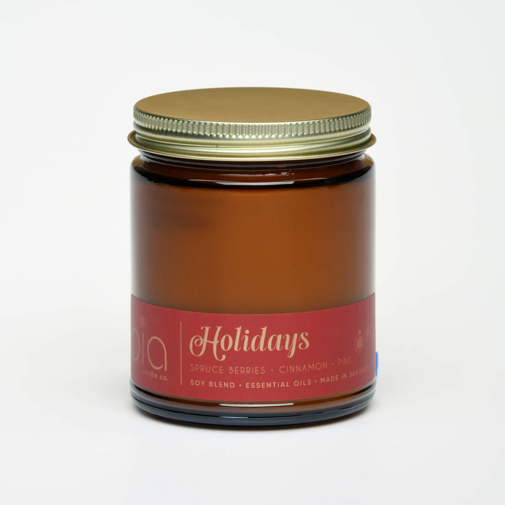unlit and lidded single wick holidays soy candle on white background