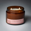 lit 2 wick honey dew me soy candle on grey background