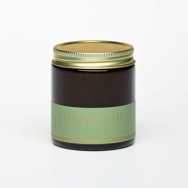 unlit and lidded petite single wick lets get lit soy candle on white background