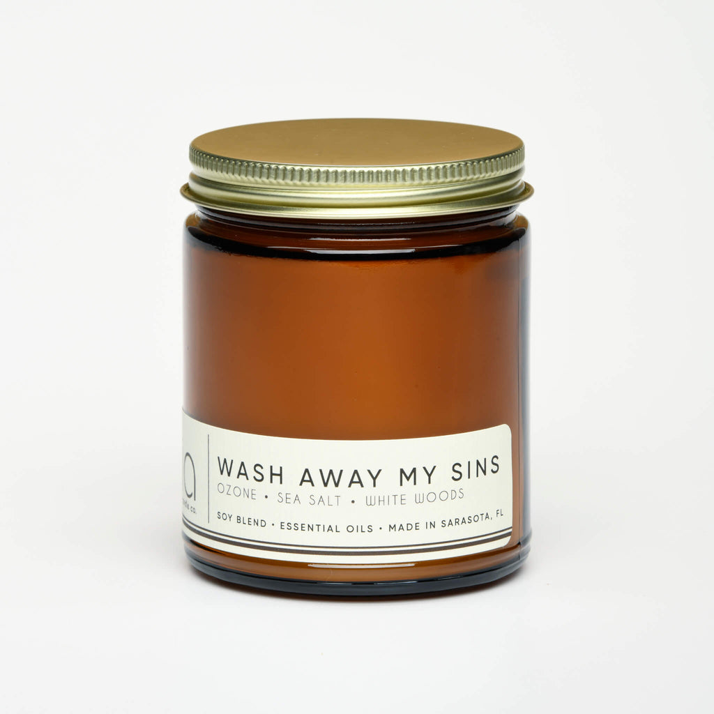 unlit and lidded single wick wash away my sins soy candle on white background